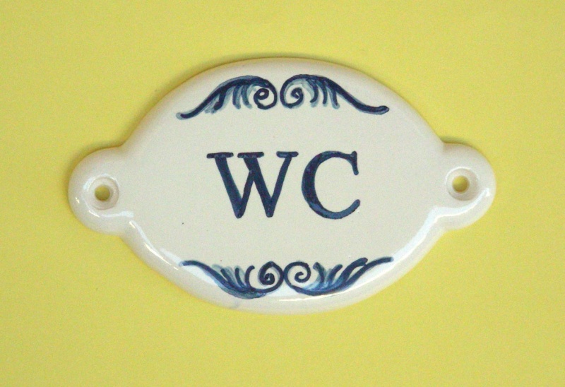 Toilets signs with ceramic glazed plaques and tiles